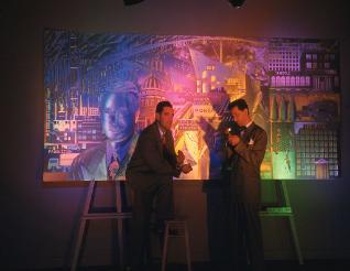 Bel-Jon and Christopher with mural under colored lights